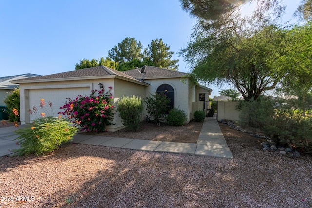 4725 E Brown Rd Unit 79, Mesa, AZ 85205 - view of front of house featuring a gate, an attached garage, stucco siding, and concrete driveway