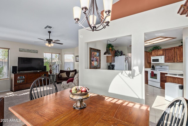 4725 E Brown Rd Unit 79, Mesa, AZ 85205 - dining room with ceiling fan and a chandelier