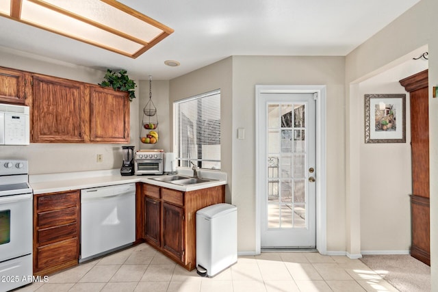 4725 E Brown Rd Unit 79, Mesa, AZ 85205 - kitchen with white appliances, healthy amount of natural light, and light countertops