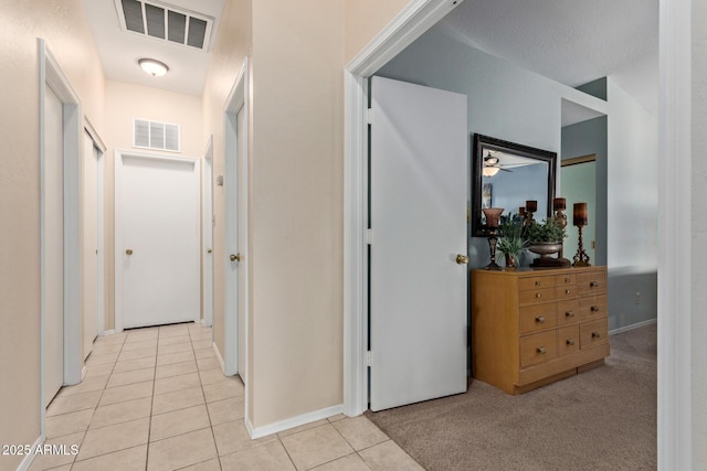 4725 E Brown Rd Unit 79, Mesa, AZ 85205 - hallway featuring light tile patterned floors and baseboards