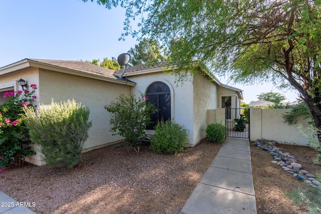4725 E Brown Rd Unit 79, Mesa, AZ 85205 - view of side of property featuring a gate and stucco siding