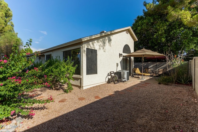 4725 E Brown Rd Unit 79, Mesa, AZ 85205 - rear view of house with a patio and stucco siding