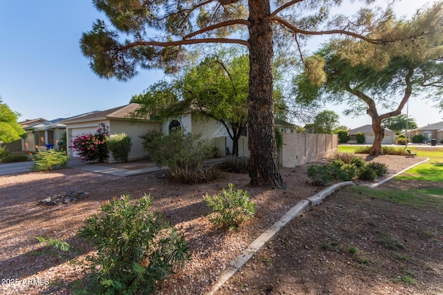 4725 E Brown Rd Unit 79, Mesa, AZ 85205 - view of front of home featuring a garage, stucco siding, and a residential view