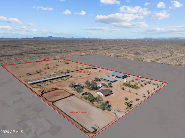 birds eye view of property with a mountain view, a rural view, and view of desert