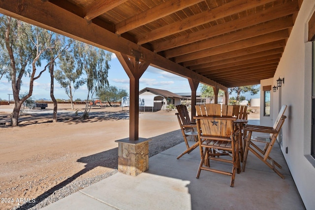 view of patio featuring outdoor dining area