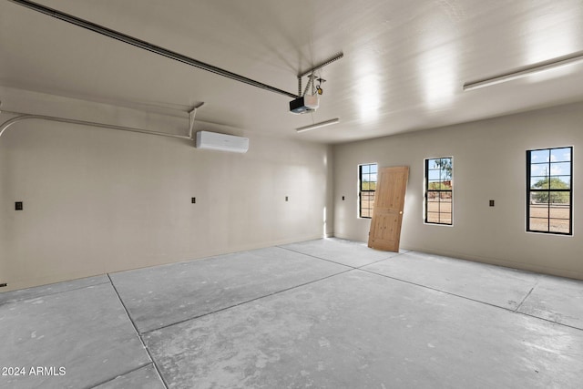 garage with a garage door opener and a wall unit AC