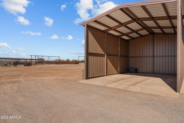 view of outdoor structure with an outbuilding and fence