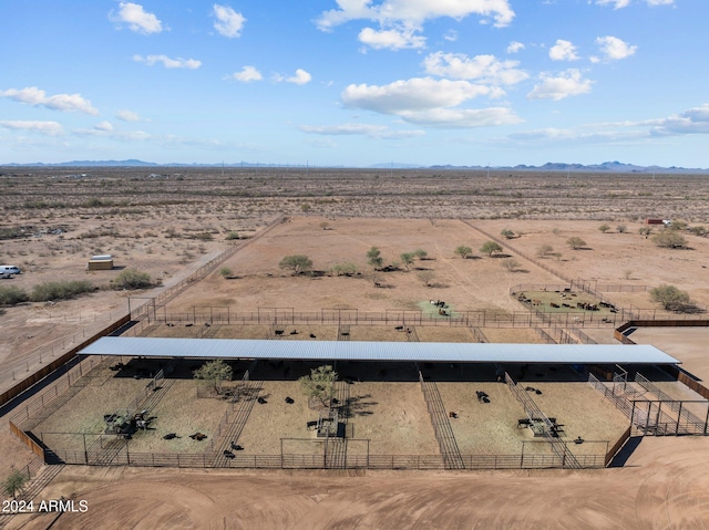 birds eye view of property with a mountain view, a desert view, and a rural view