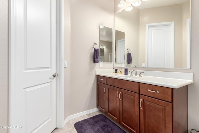 bathroom featuring tile patterned flooring and vanity