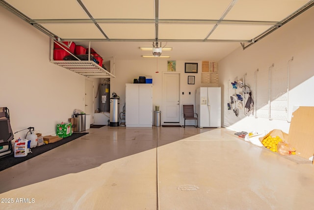 garage featuring a garage door opener, white refrigerator with ice dispenser, and water heater