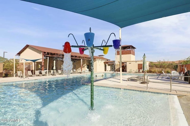 view of swimming pool featuring pool water feature