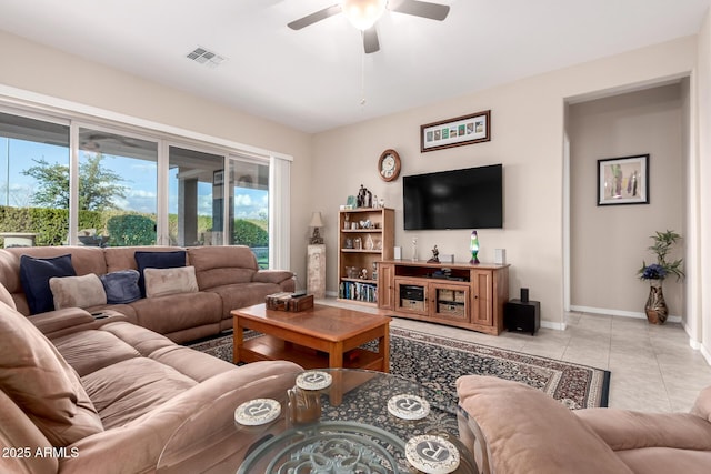 living room with ceiling fan and light tile patterned floors