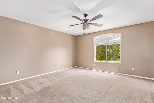 empty room featuring carpet and ceiling fan