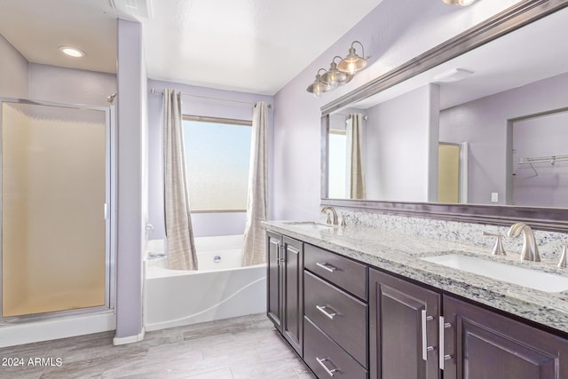 bathroom with vanity, separate shower and tub, and wood-type flooring