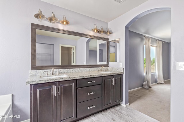 bathroom featuring vanity and hardwood / wood-style flooring