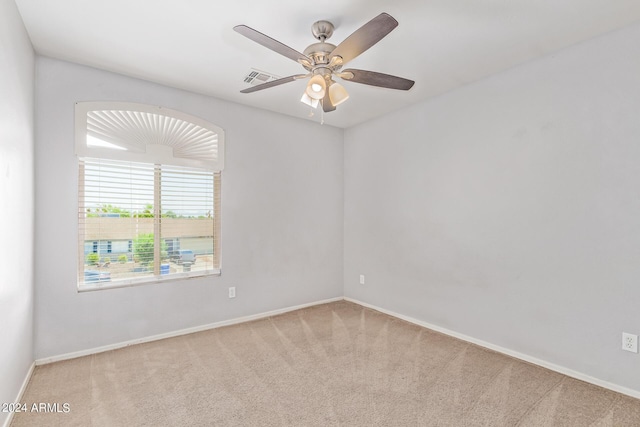 carpeted empty room with ceiling fan