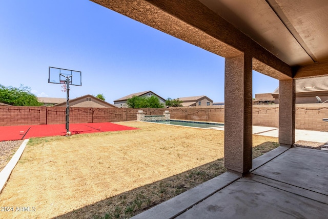 view of sport court with a fenced in pool