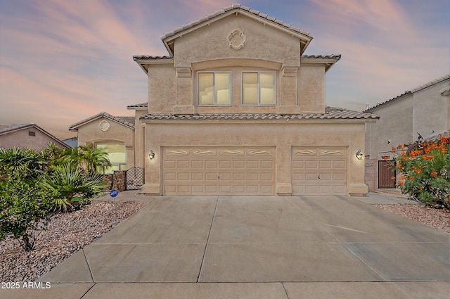 20809 N 17th St, Phoenix, AZ 85024 - mediterranean / spanish-style house featuring an attached garage, a tile roof, concrete driveway, and stucco siding