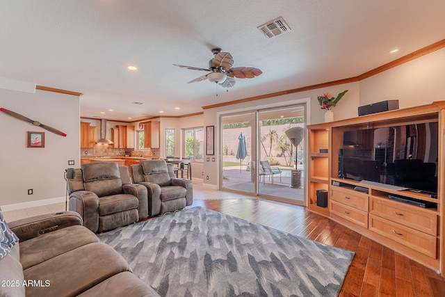 20809 N 17th St, Phoenix, AZ 85024 - living room with crown molding, a ceiling fan, hardwood / wood-style floors, and recessed lighting