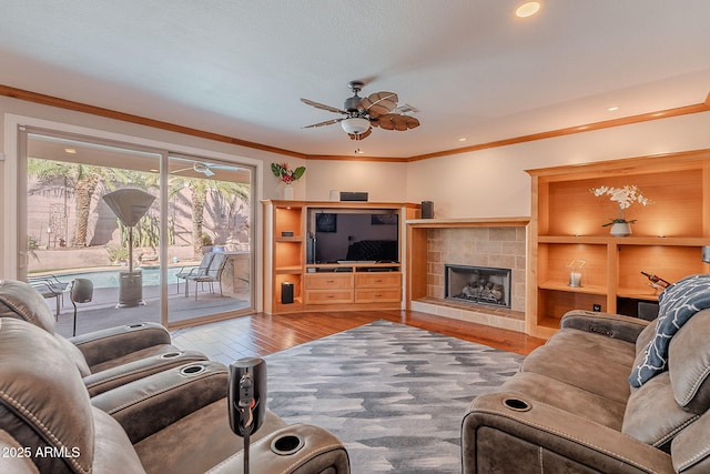 20809 N 17th St, Phoenix, AZ 85024 - living area featuring a ceiling fan, wood finished floors, recessed lighting, a fireplace, and ornamental molding