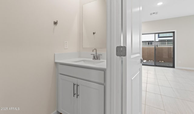 bathroom with tile patterned flooring, visible vents, vanity, and baseboards