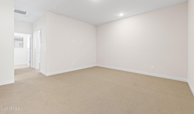 carpeted spare room with visible vents, recessed lighting, and baseboards