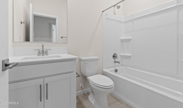 bathroom featuring vanity,  shower combination, toilet, and wood finished floors