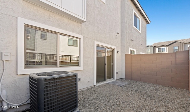 back of property featuring central air condition unit, stucco siding, a patio, and fence