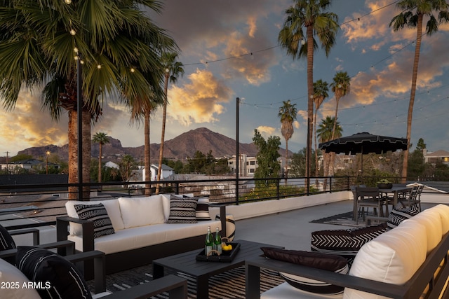 4120 N 44th Pl, Phoenix, AZ 85018 - patio terrace at dusk featuring an outdoor hangout area and a mountain view