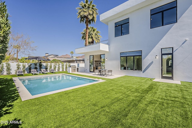 4120 N 44th Pl, Phoenix, AZ 85018 - back of property featuring a balcony, stucco siding, and a patio