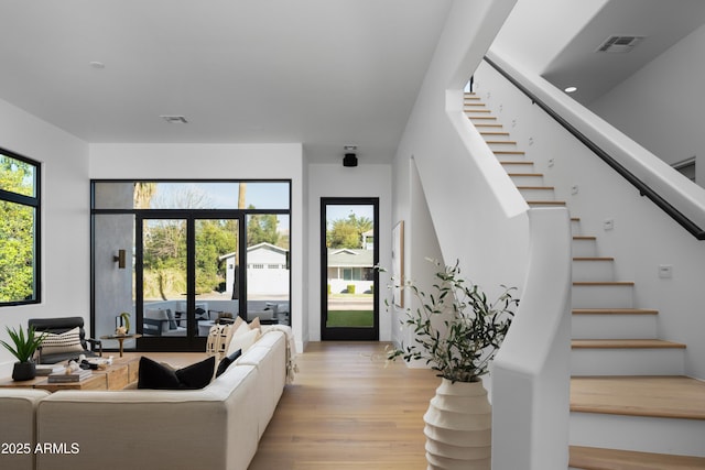 4120 N 44th Pl, Phoenix, AZ 85018 - living room featuring light wood-style floors and stairway