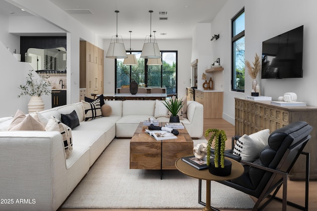4120 N 44th Pl, Phoenix, AZ 85018 - living room featuring light wood-type flooring and recessed lighting