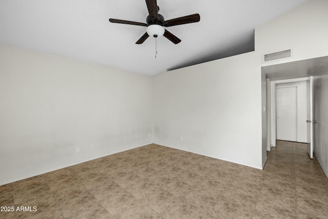 unfurnished room featuring vaulted ceiling and ceiling fan