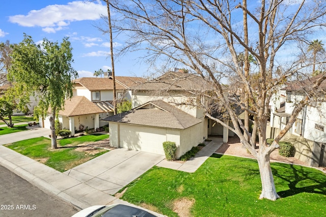 view of front of house with a garage and a front lawn