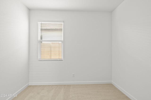 empty room with light colored carpet