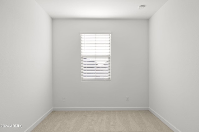 empty room with light colored carpet