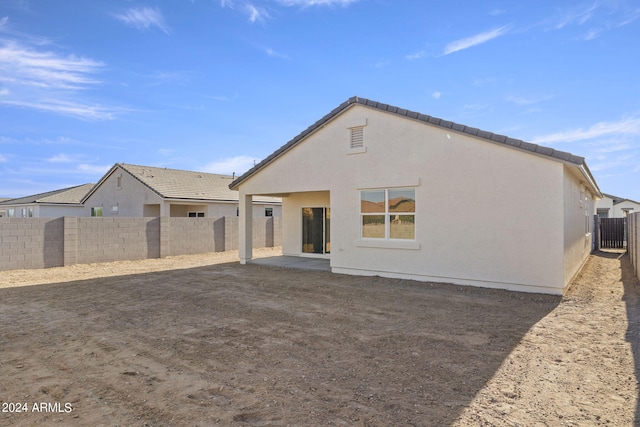 back of house featuring a patio