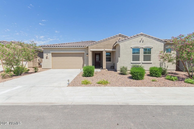 5139 N 185th Ave, Litchfield Park, AZ 85340 - view of front of property featuring stucco siding, a tiled roof, a garage, and concrete driveway