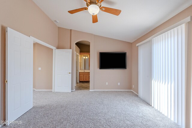 20277 N 68th Dr, Glendale, AZ 85308 - unfurnished living room featuring lofted ceiling, arched walkways, light colored carpet, and a ceiling fan