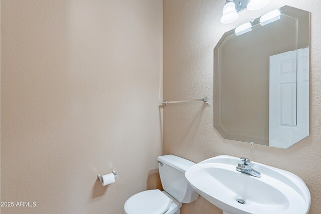 20277 N 68th Dr, Glendale, AZ 85308 - half bathroom with a sink and a textured wall