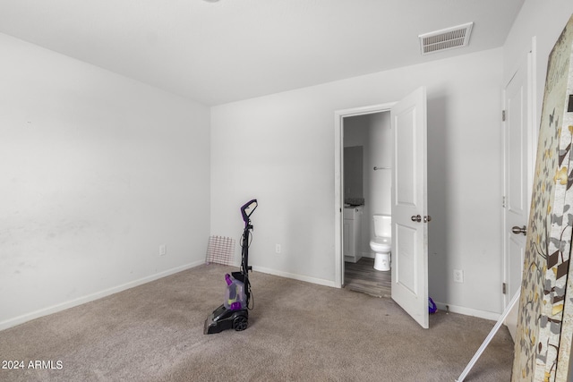 bedroom featuring light carpet