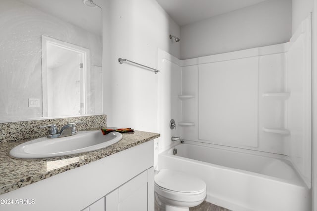 full bathroom with vanity, toilet, and shower / tub combination