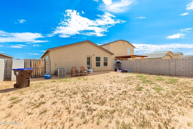 back of property with central AC unit