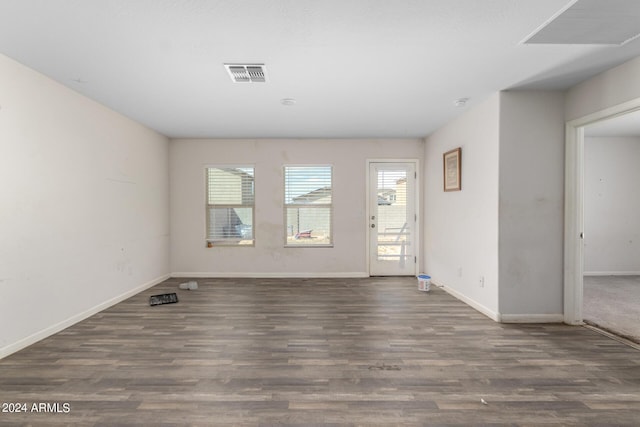 unfurnished room with dark hardwood / wood-style floors