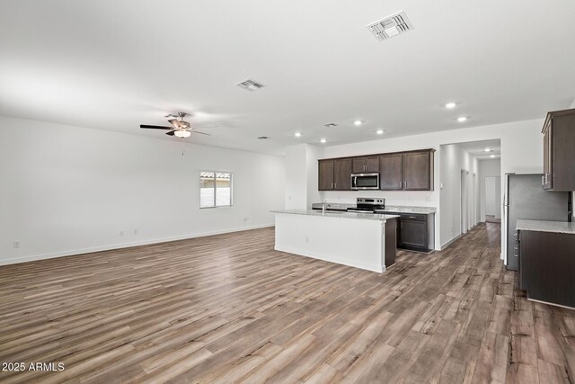 680 W Crowned Dove Trl, Casa Grande, AZ 85122 - kitchen with appliances with stainless steel finishes, open floor plan, visible vents, and recessed lighting