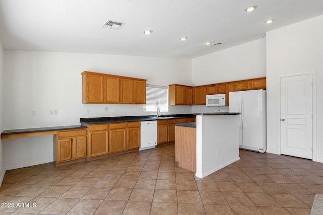 1669 E Santa Fiore St, San Tan Valley, AZ 85140 - kitchen featuring white appliances, a sink, a center island, high vaulted ceiling, and recessed lighting