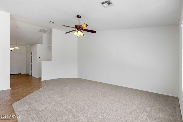 1669 E Santa Fiore St, San Tan Valley, AZ 85140 - unfurnished living room featuring light tile patterned flooring, light colored carpet, ceiling fan, baseboards, and high vaulted ceiling