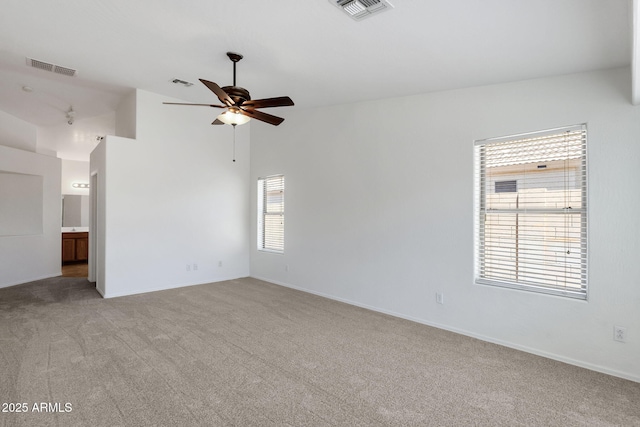 1669 E Santa Fiore St, San Tan Valley, AZ 85140 - spare room featuring a ceiling fan, light carpet, lofted ceiling, and baseboards