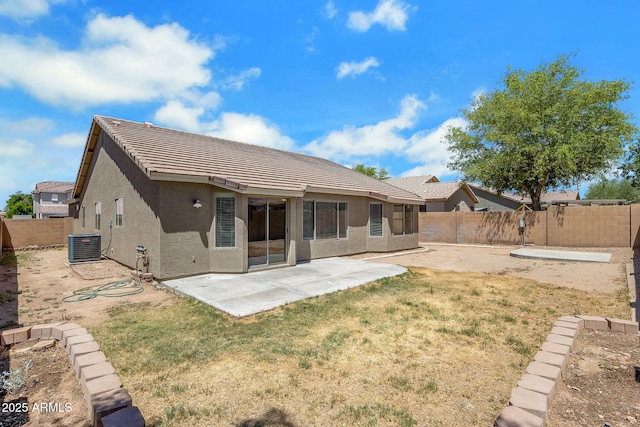 1669 E Santa Fiore St, San Tan Valley, AZ 85140 - back of house with stucco siding, a tiled roof, a patio, and central AC