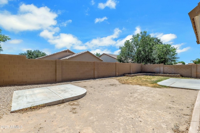 1669 E Santa Fiore St, San Tan Valley, AZ 85140 - fenced backyard with a patio area